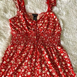 A cute red summer romper (shorts) perfect for summer time